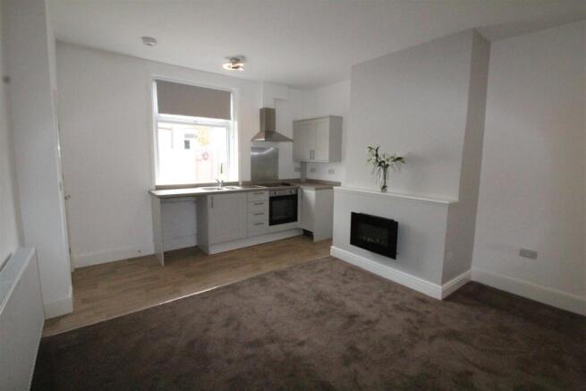 LOUNGE WITH KITCHEN AREA