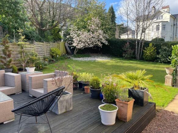 Deck and charming, flat garden