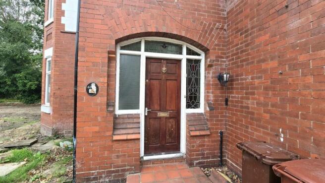 Charming entrance to a characterful brick home...