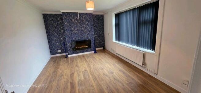 Bright living room with modern flooring and foc...