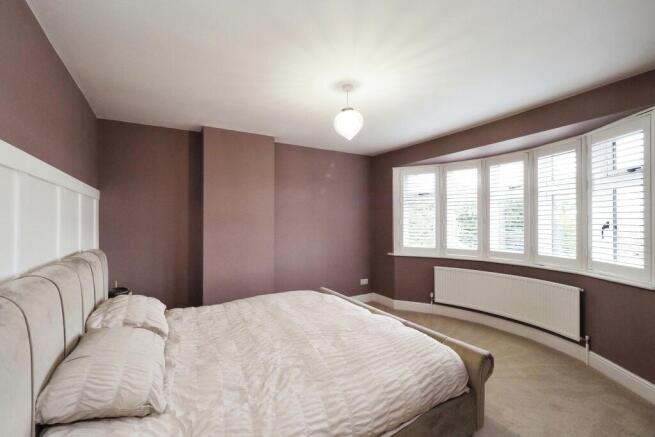 Generous Bedroom One with Bay Window and Shutters