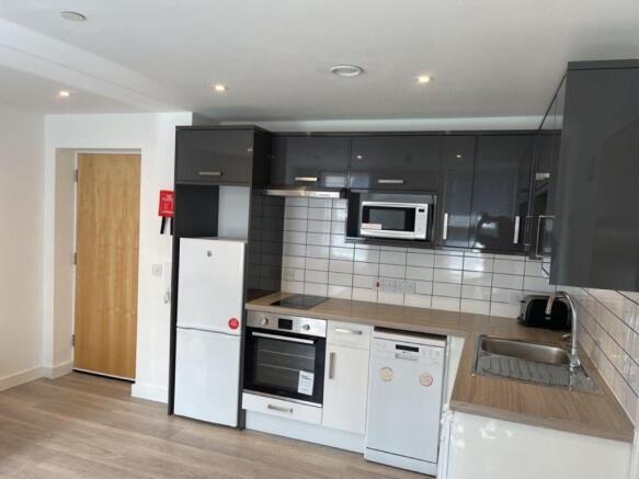 Modern gloss kitchen with high-end appliances...