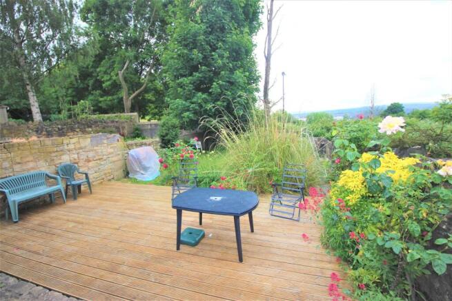 Spacious wooden decking and lush garden area...