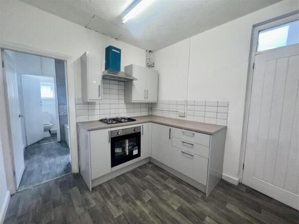 Modern fitted kitchen with sleek appliances...