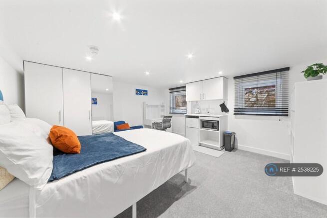 Basement Bedroom With Tea Station