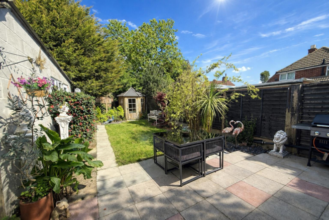 Bright backyard garden on a sunny day.png