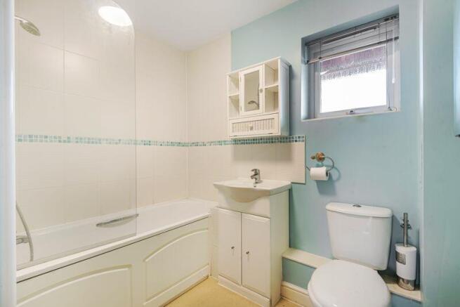 Bathroom with over-bath shower