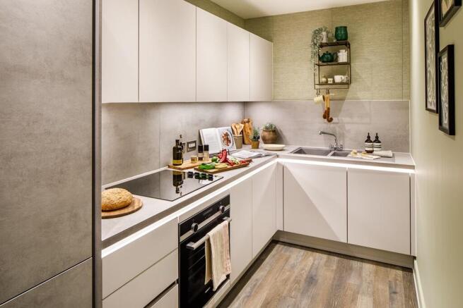 Each kitchen includes integrated appliances & makes food prep easy - typical Taylor Wimpey apartment