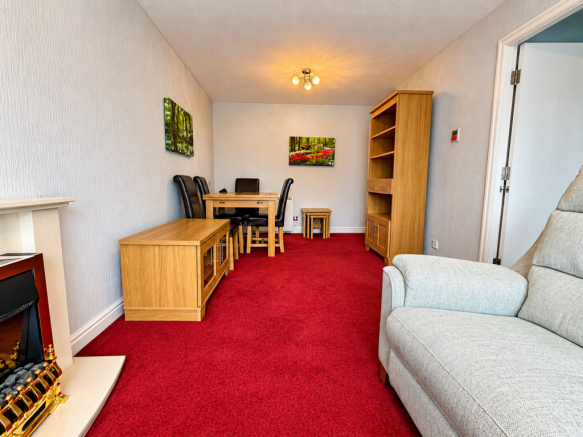 Cozy Red-Carpet Dining Room.png