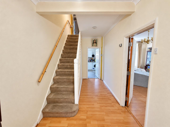Bright Tidy Hallway with Staircase.png
