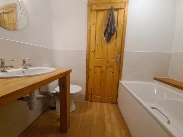 A bright and clean bathroom with a modern desig...