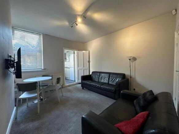 Bright lounge with sleek sofas and dining space...