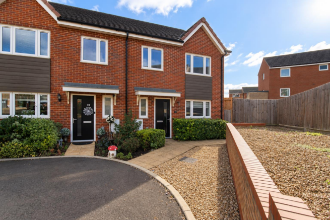 Sunny Brick Townhouse Frontage with Garden Details