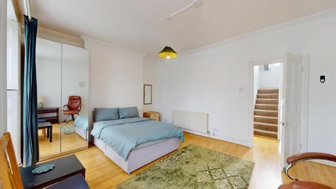 Spacious double bedroom with mirrored storage...
