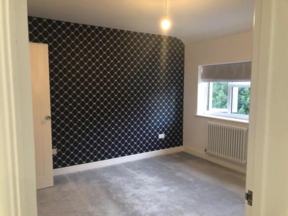 On the left of the kitchen is bedroom 1