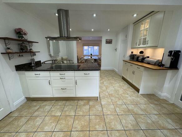 8 - Kitchen to Dining Room.jpg