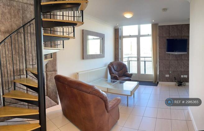 Lounge With Dock View, Balcony & Spiral Staircase 