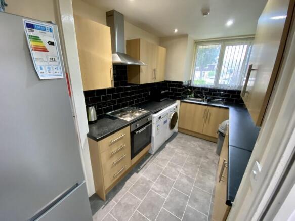 A modern and tidy kitchen with ample storage an...