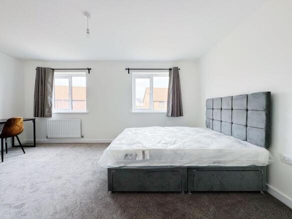 Bright, freshly decorated double bedroom with a...