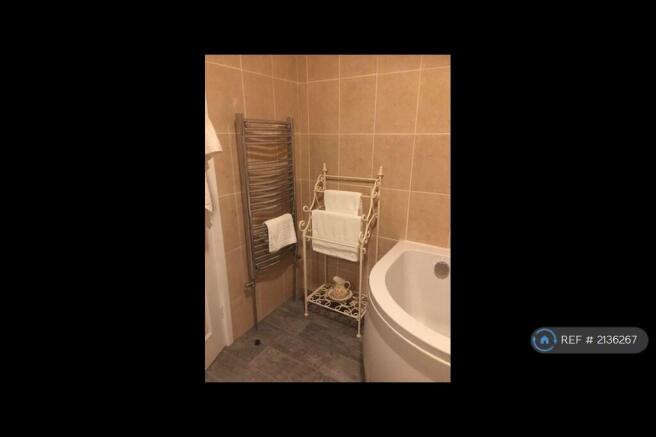 Spacious Bathroom Corner Bath And Shower