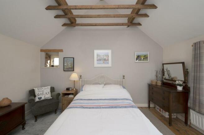 Bedroom Two - bed and vaulted ceiling.jpg