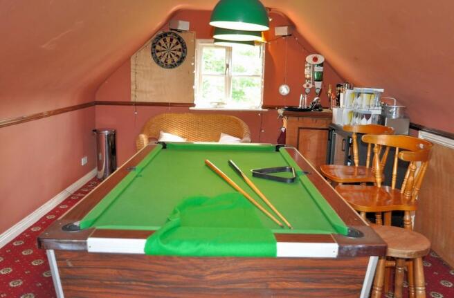 The pool table, included within a sale