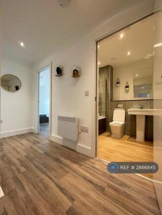 Hallway To Bathroom And Bedrooms