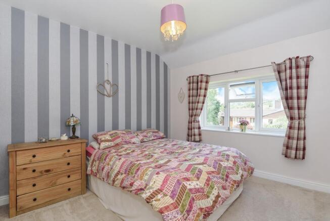 One of three bedrooms
