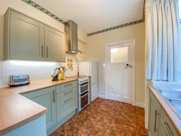 Kitchen leading to utility
