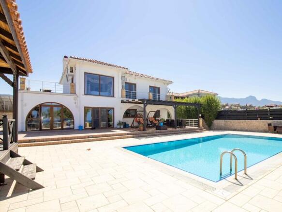 Seafront 4-bedroom magnificent resale villa,1,500 m2 plot size,fully furnished.5m x 10 m private pool,gas central heating,stone double garage,Title deed in the owner?s name VAT paid Image 9999 1