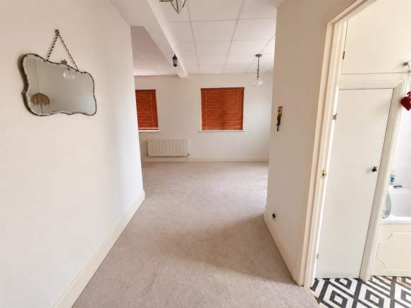 Unfurnished hallway and living room.png
