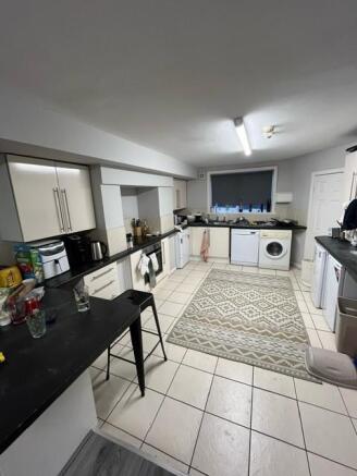 A bright and well-maintained kitchen area featu...