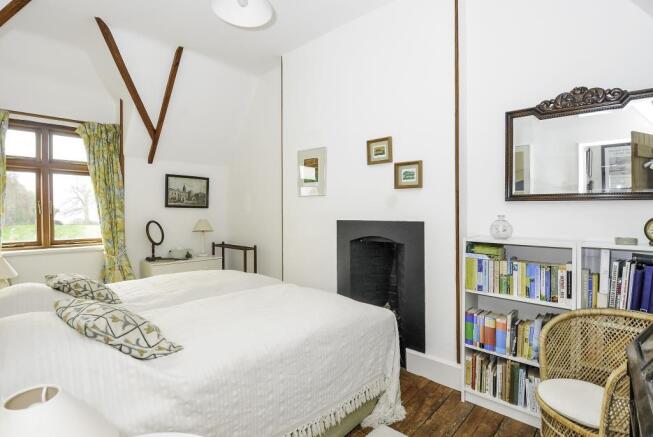Double bedroom with feature fireplace