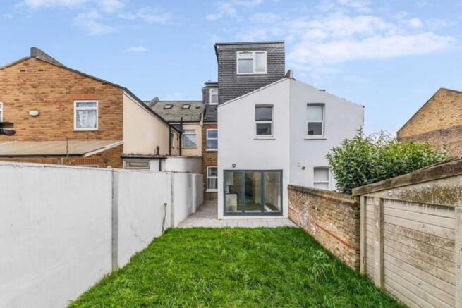 Spacious private garden with fresh green lawn...