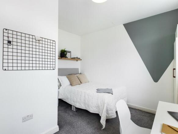 A bright and inviting double bedroom, perfect f...