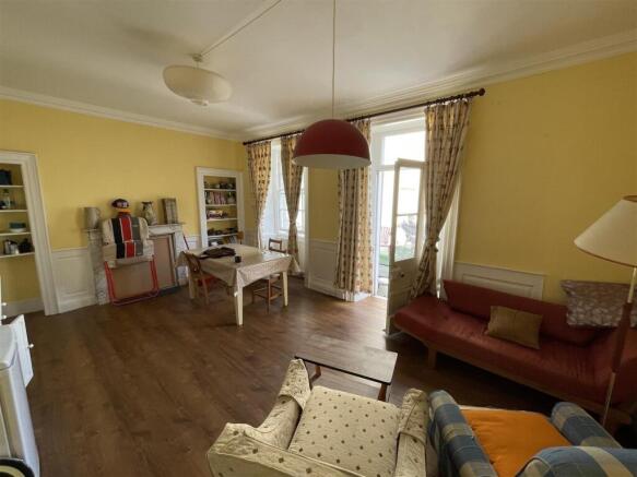 Spacious and bright living room with seating...