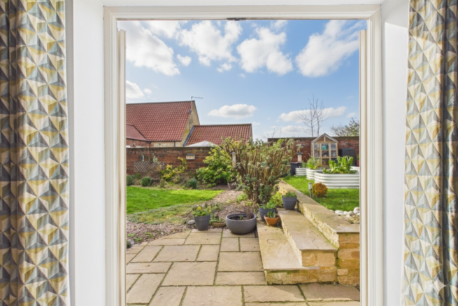 Patio doors lead from this bedroom straight into t
