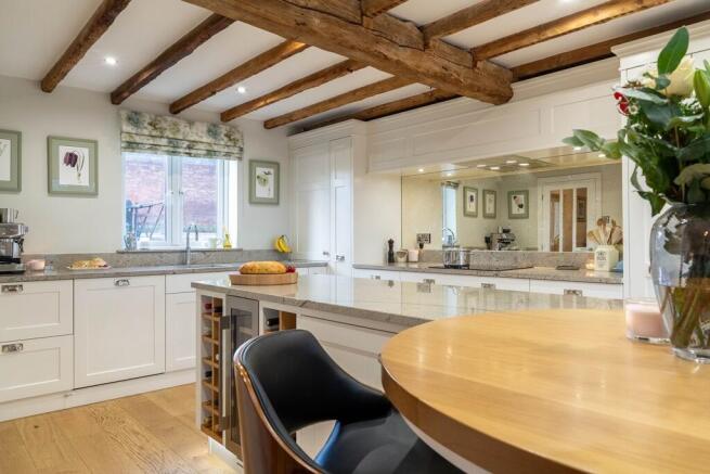Exposed beam, granite and oak worktops