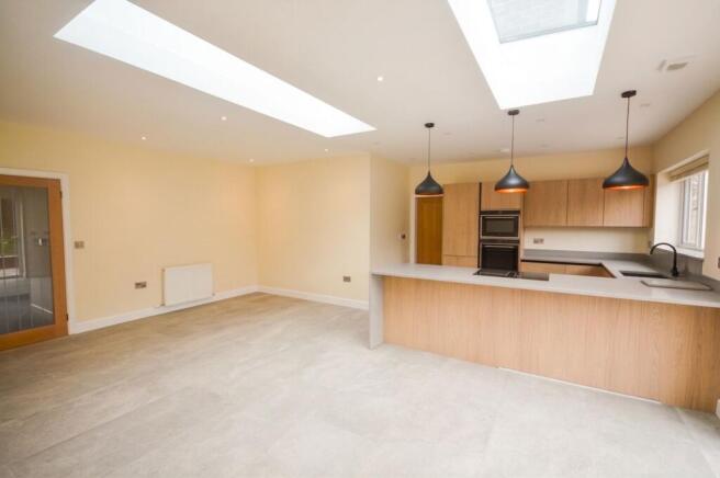 Kitchen opening to Dining and Family area