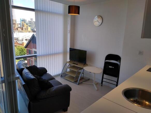 Bright lounge area with large floor-to-ceiling ...