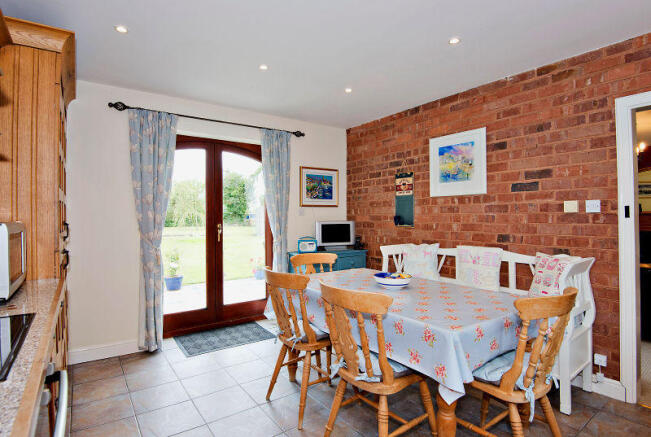Kitchen with double doors to patio and rear garden
