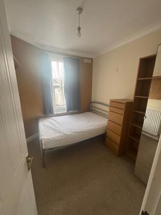 Bright bedroom with ample storage and double be...