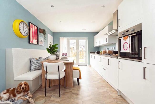 The kitchen/dining area boasts double doors out to the garden