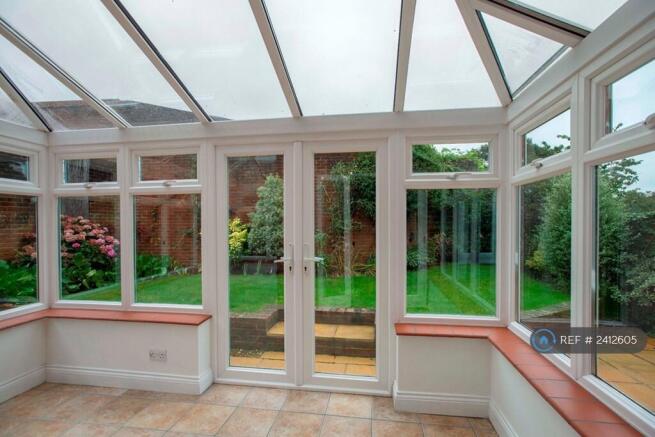 Inside Conservatory Onto The Garden
