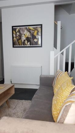 Stylish lounge with plush sofa and modern art...