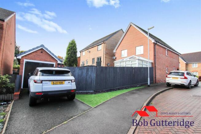 OFF ROAD PARKING AND BRICK GARAGE