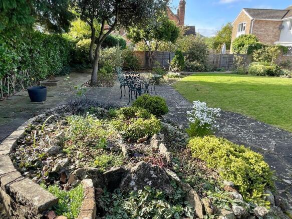 Rear terrace and rockery