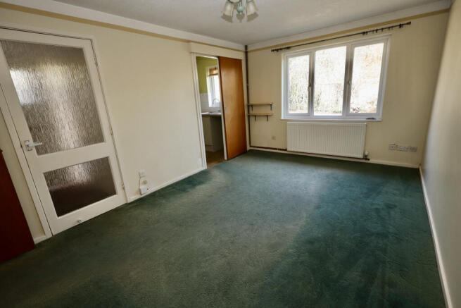 Sitting room through to kitchen