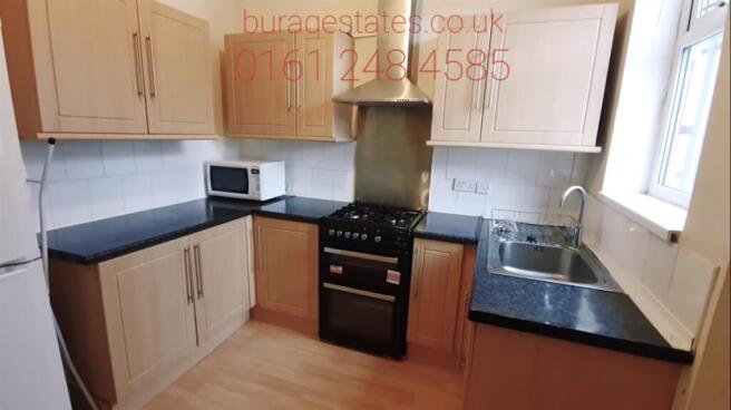 Bright, modern kitchen with plentiful worktop s...