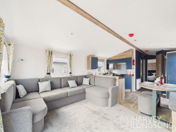 Spacious lounge with corner sofa, dining area and